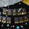 Happy new year banner i sort og guld